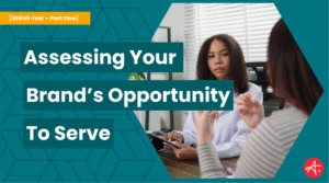 Two professionals engage in a thoughtful conversation across a desk, representing a strategic business discussion. Text overlay reads: Assessing Your Brand’s Opportunity to Serve – [SERVE•ival – Part One].