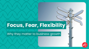 Graphic featuring the headline Focus, Fear, Flexibility with a photo of a blank multi-directional signpost against the sky, symbolizing decision-making and business direction.