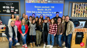 Authentic Two or More volunteers at Feed My Starving Children