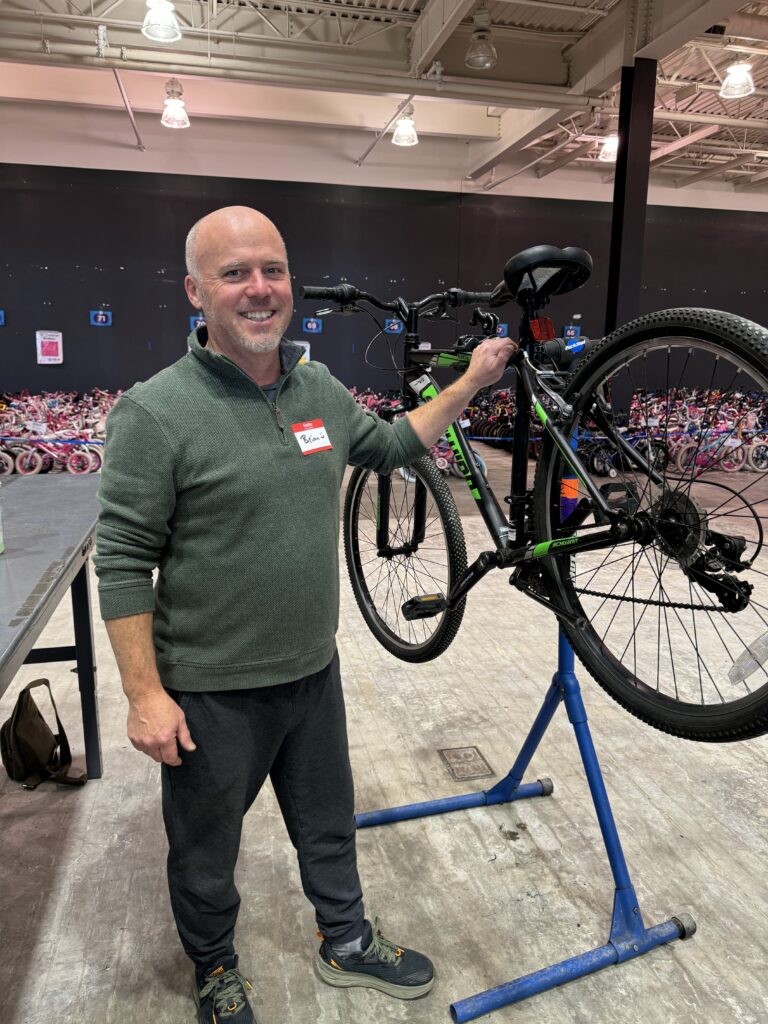 Two or More volunteer working on bikes at FB4K