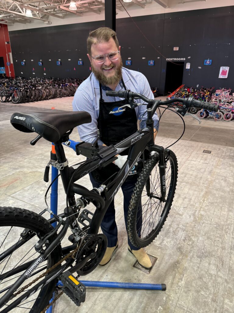 Two or More volunteer working on bikes at FB4K