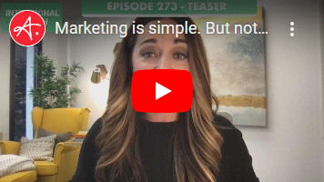 A thumbnail image of a professional woman speaking in a video, with text reading 'Marketing is simple. But not...' and a red YouTube play button overlay in the center. The background shows a modern office with a yellow chair and green plants.