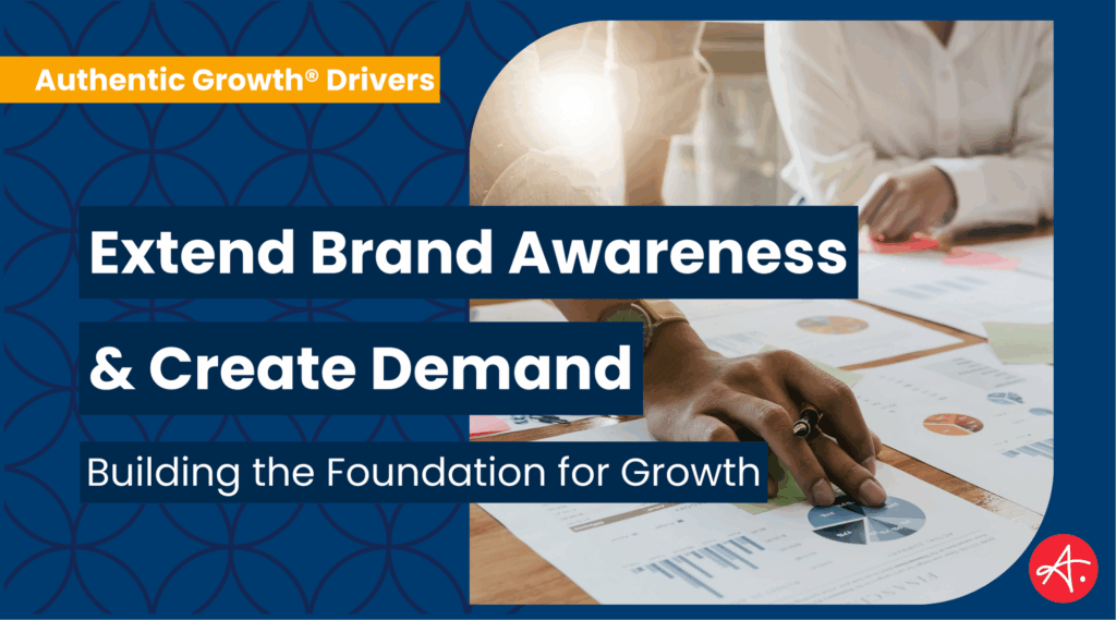 Professionals analyzing charts and graphs on a desk, showcasing strategies to extend brand awareness and create demand.