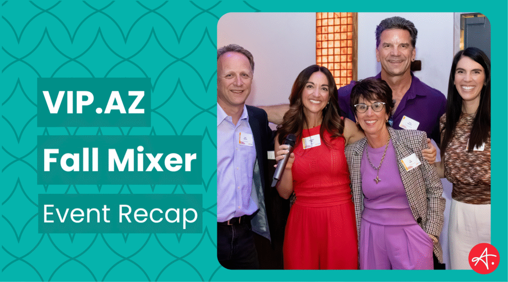 Group of five smiling professionals at the VIP.AZ Fall Mixer networking event, standing together in a warmly lit venue, holding a microphone and wearing event name tags, with “VIP.AZ Fall Mixer Event Recap” text on a teal patterned background.