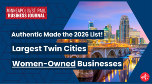 Graphic from the Minneapolis/St. Paul Business Journal announcing that Authentic made the 2026 list of the Largest Twin Cities Women-Owned Businesses, with a Minneapolis skyline and bridge at dusk.