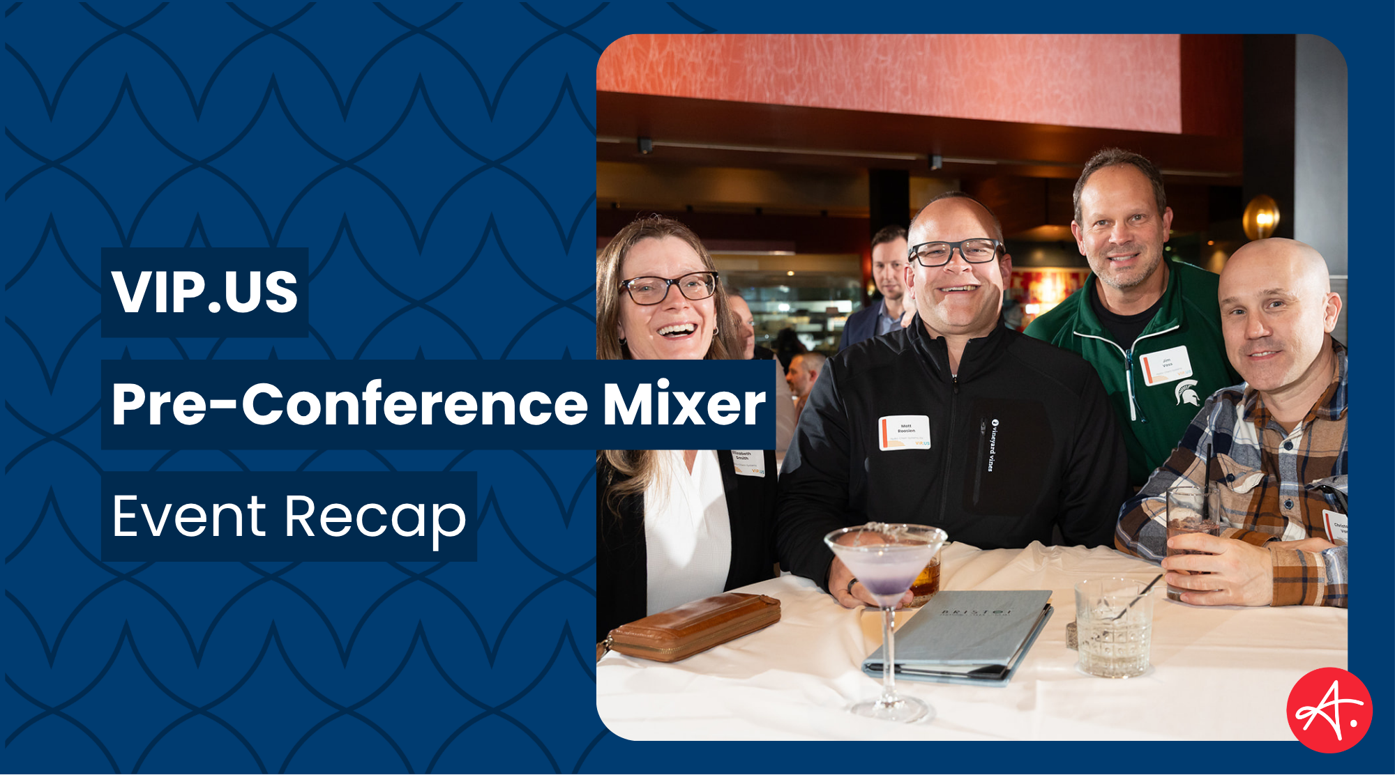 Four smiling professionals pose together at a cocktail bar during the VIP.US Pre-Conference Mixer, with drinks and a menu visible on the table in front of them.