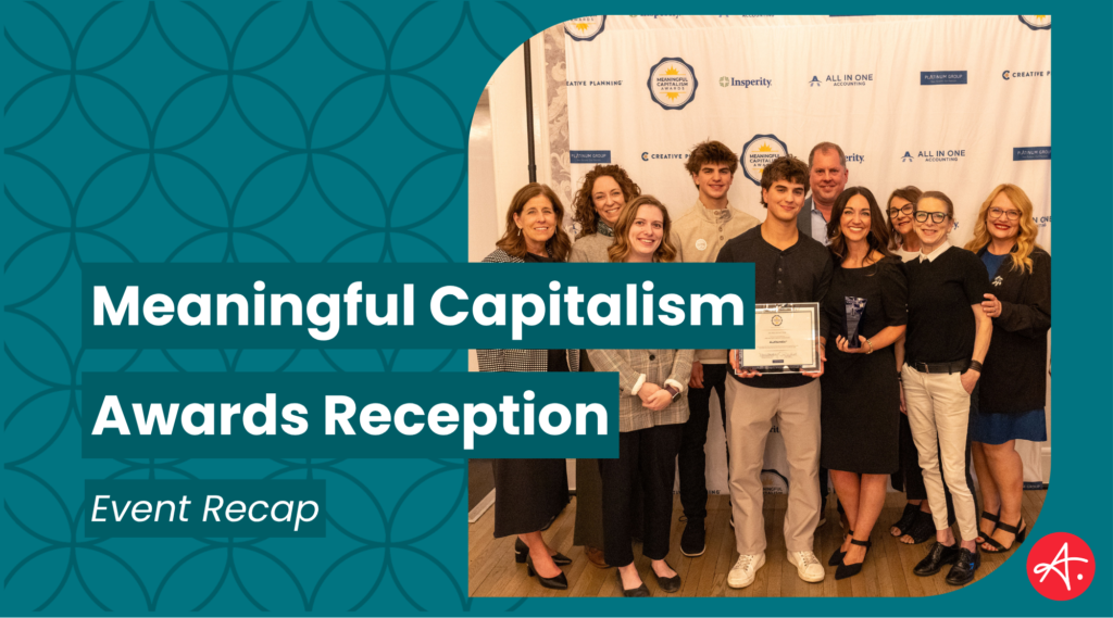 A group of smiling attendees poses together at the Meaningful Capitalism Awards Reception, with one person holding an award trophy in front of a branded step-and-repeat backdrop featuring sponsors including Creative Planning, Insperity, All In One Accounting, and Platinum Group.